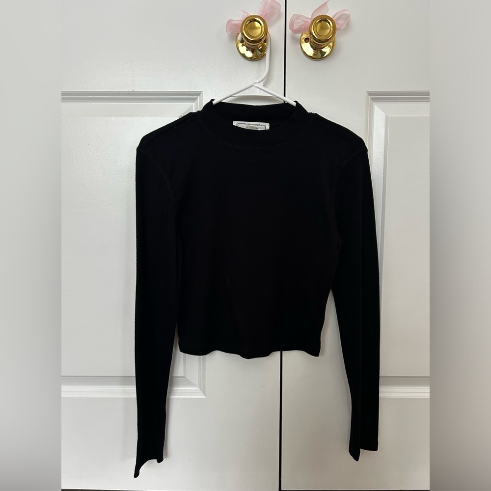 Black long sleeve turtleneck, ribbed slightly, brand is Hippie Rose, Size Medium